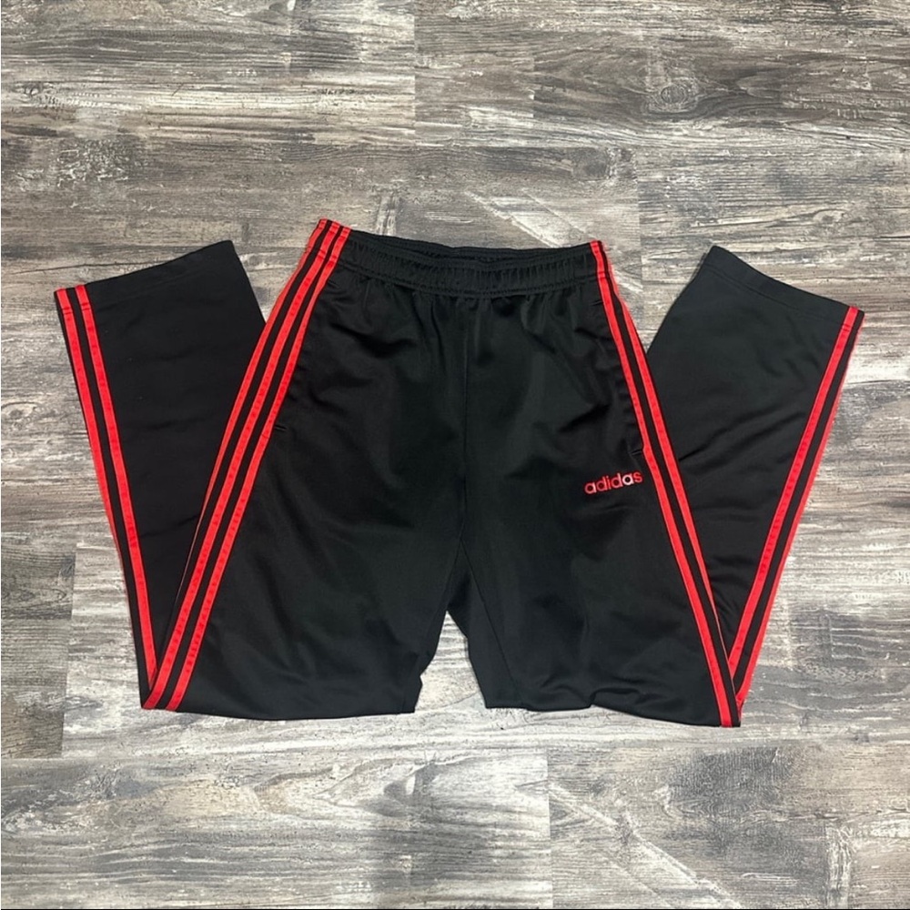 Adidas classic track pants size small in black with red stripes
